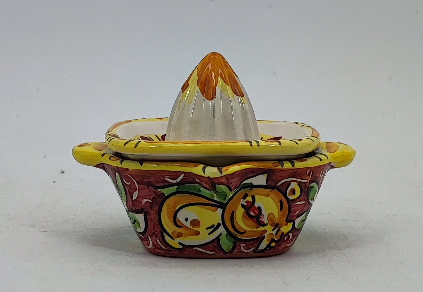 Detailed Mediterranean decoration on a turquoise Caltagirone-style ceramic juicer