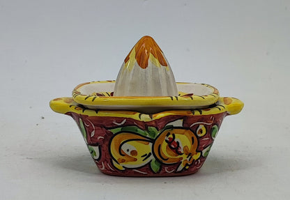 Detailed Mediterranean decoration on a turquoise Caltagirone-style ceramic juicer
