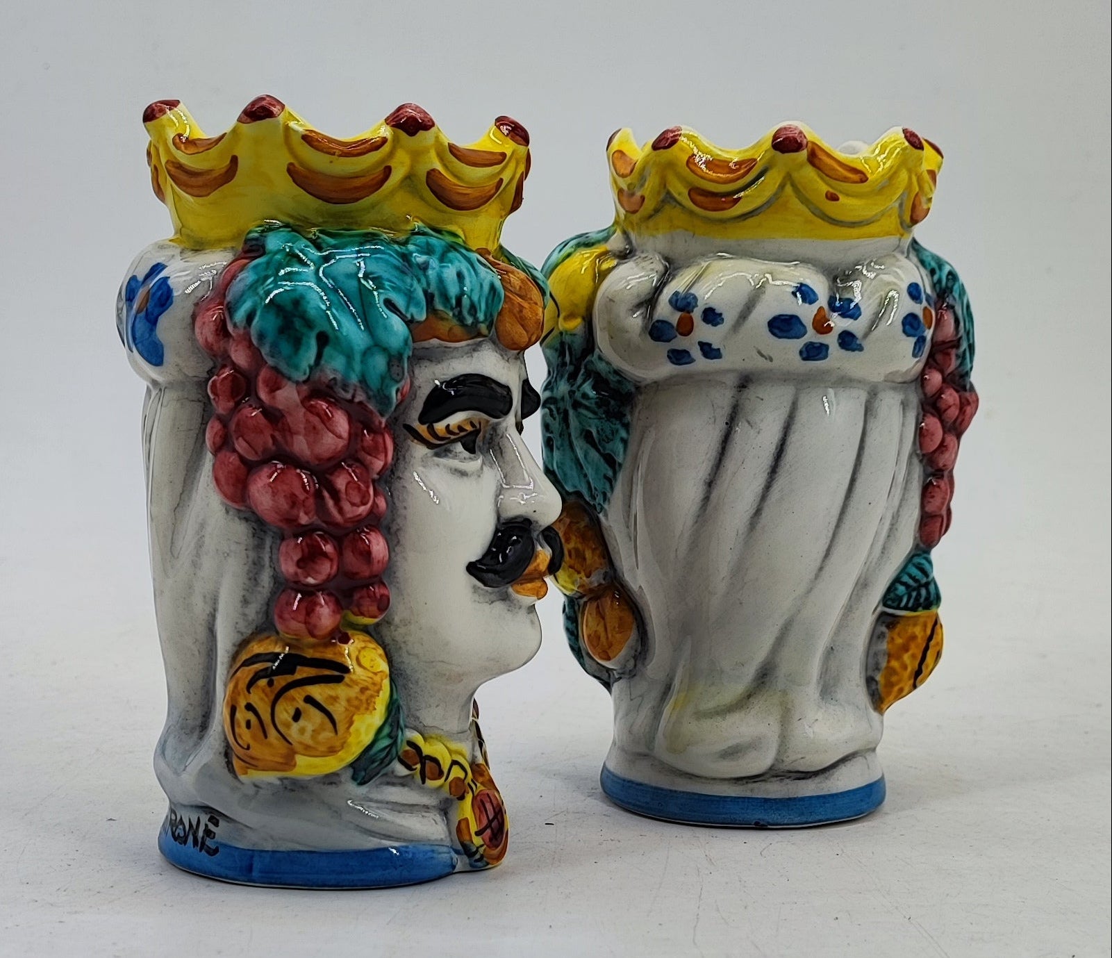 Small Sicilian Moor’s Head vases displayed as colorful Mediterranean kitchen decor
