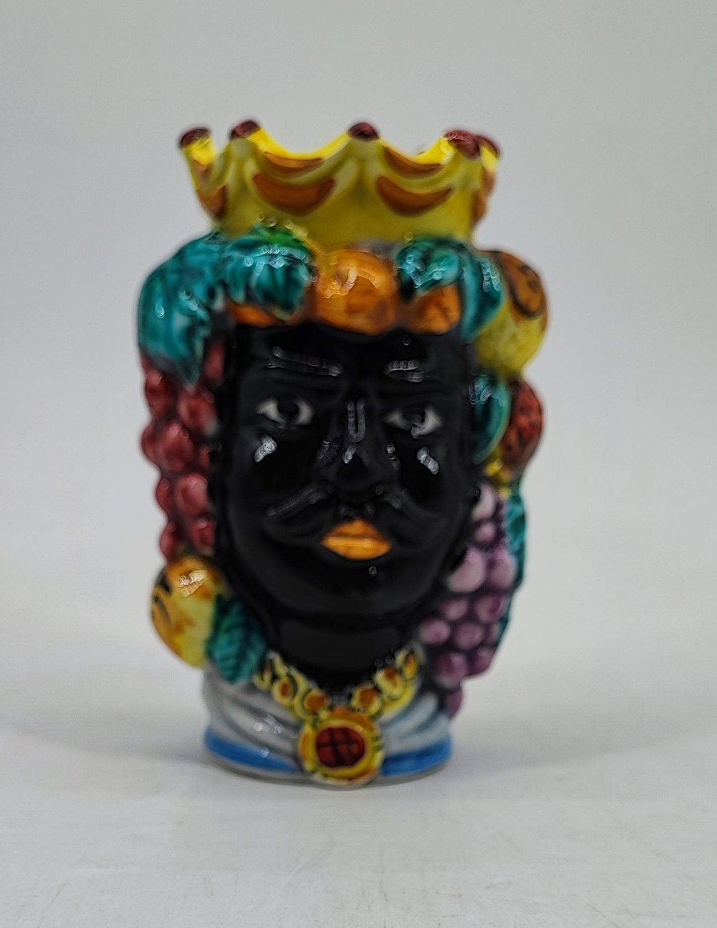 Black male Moor’s Head ceramic vase decorated with a crown, fruit and colorful Sicilian details