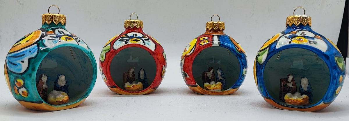 Turquoise Sicilian ceramic Christmas bauble with miniature Nativity scene