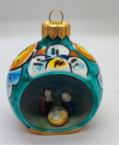 Turquoise Sicilian ceramic Christmas bauble with miniature Nativity scene