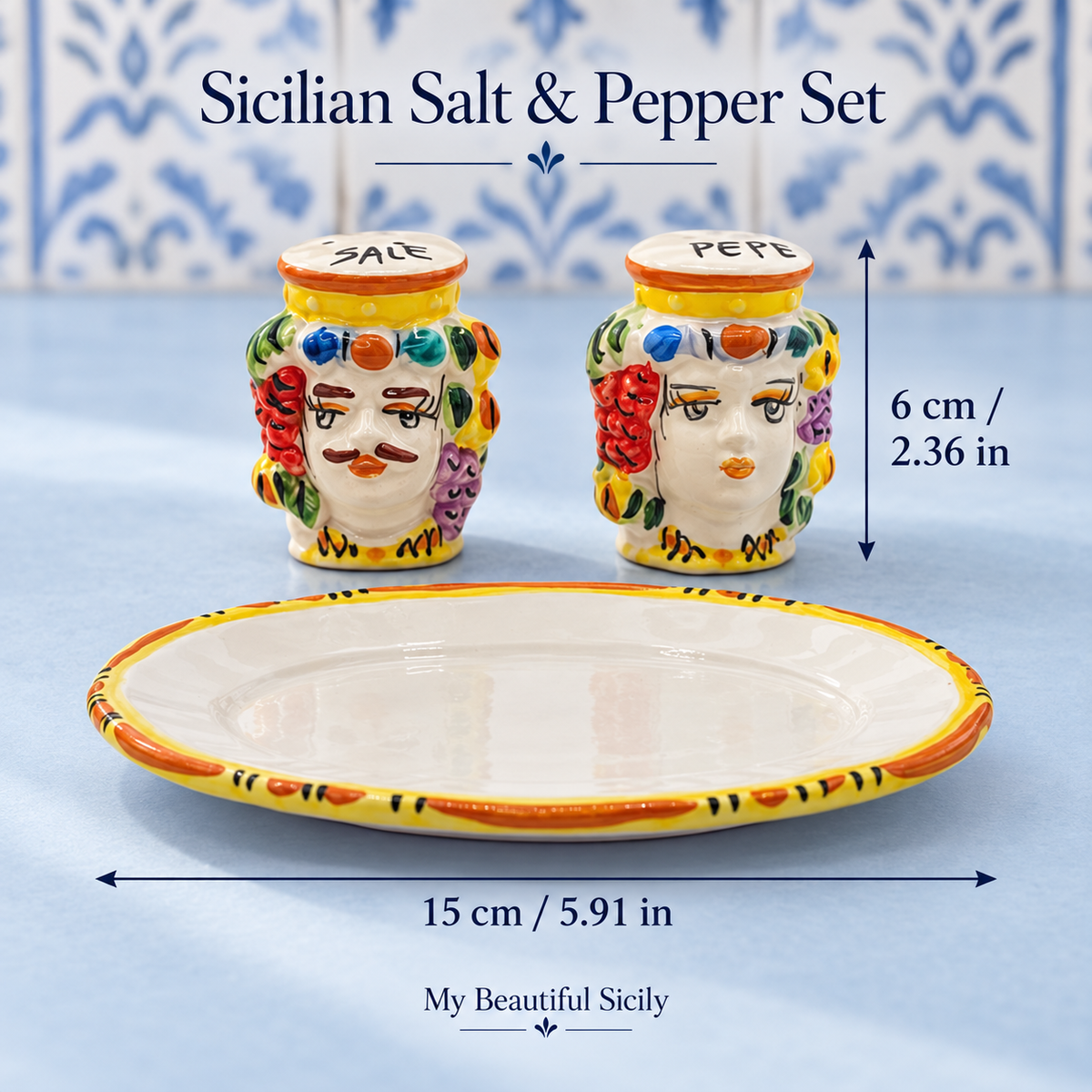 Colourful Moorish head salt and pepper set on a walnut table in an olive-green kitchen