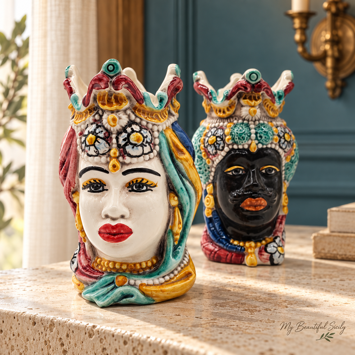 Pair of Sicilian ceramic Moorish heads with ornate crowns and turquoise, burgundy and yellow hand-painted decoration