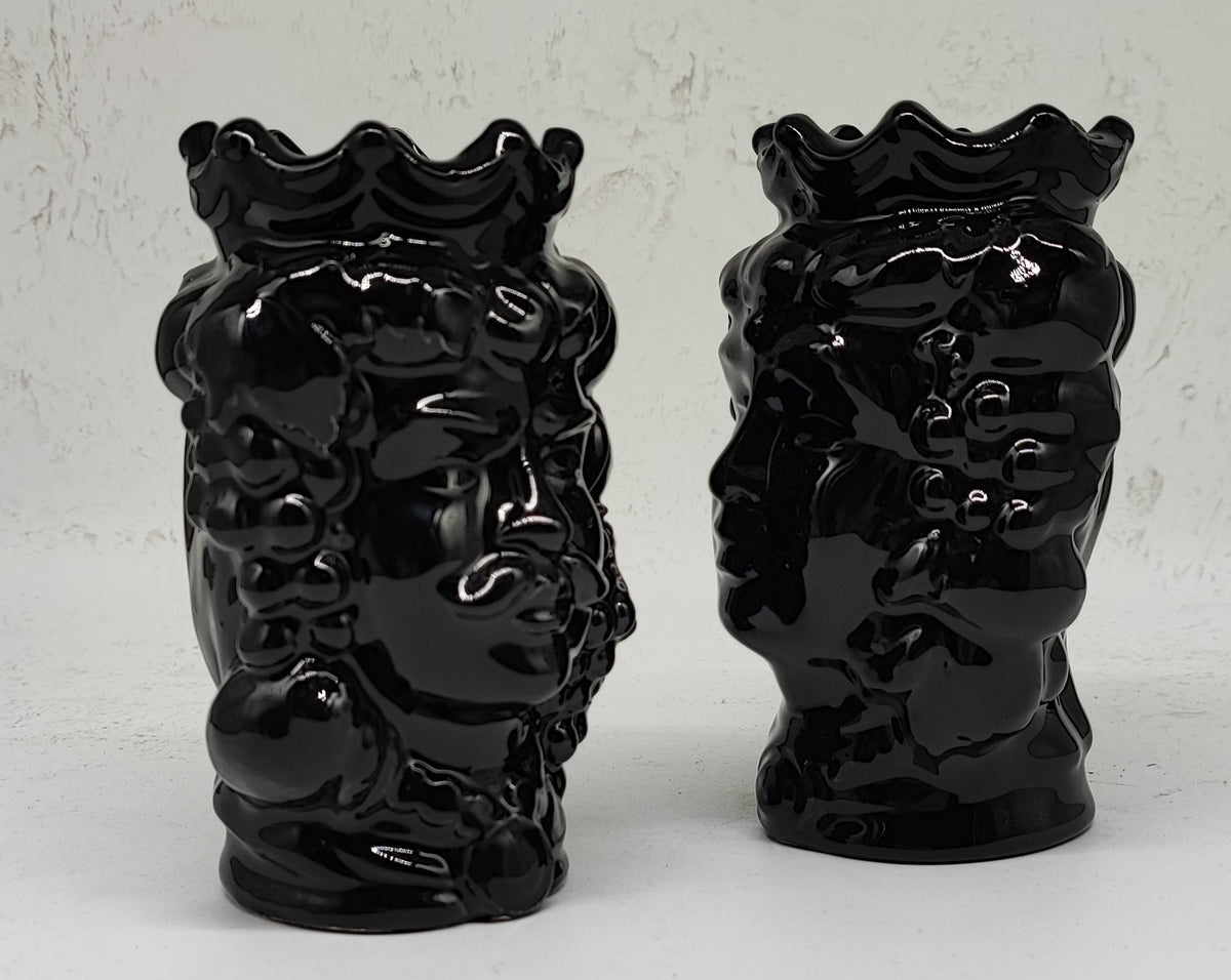 Close-up of the sculpted face and glossy black glaze on a Sicilian Moorish head vase