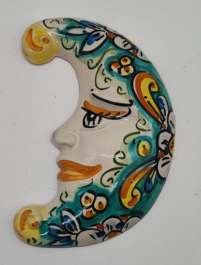 Handmade blue and white Sicilian ceramic crescent moon with sculpted face and painted scrollwork