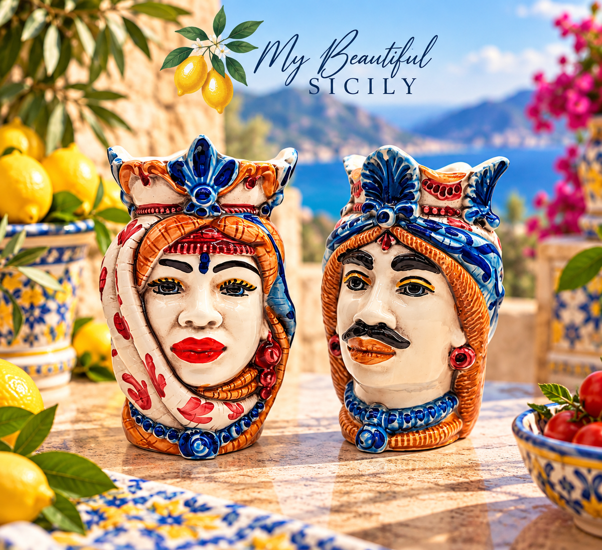 Sicilian ceramic Moorish Heads displayed in a Mediterranean setting, traditional Teste di Moro made in Sicily.