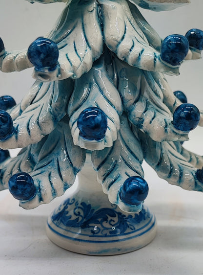 Blue and white Caltagirone ceramic Christmas tree measuring 21 cm high and 17 cm wide, approximately 8.3 by 6.7 inches.