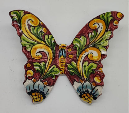 Hand-painted Sicilian ceramic butterflies arranged as colorful wall decor