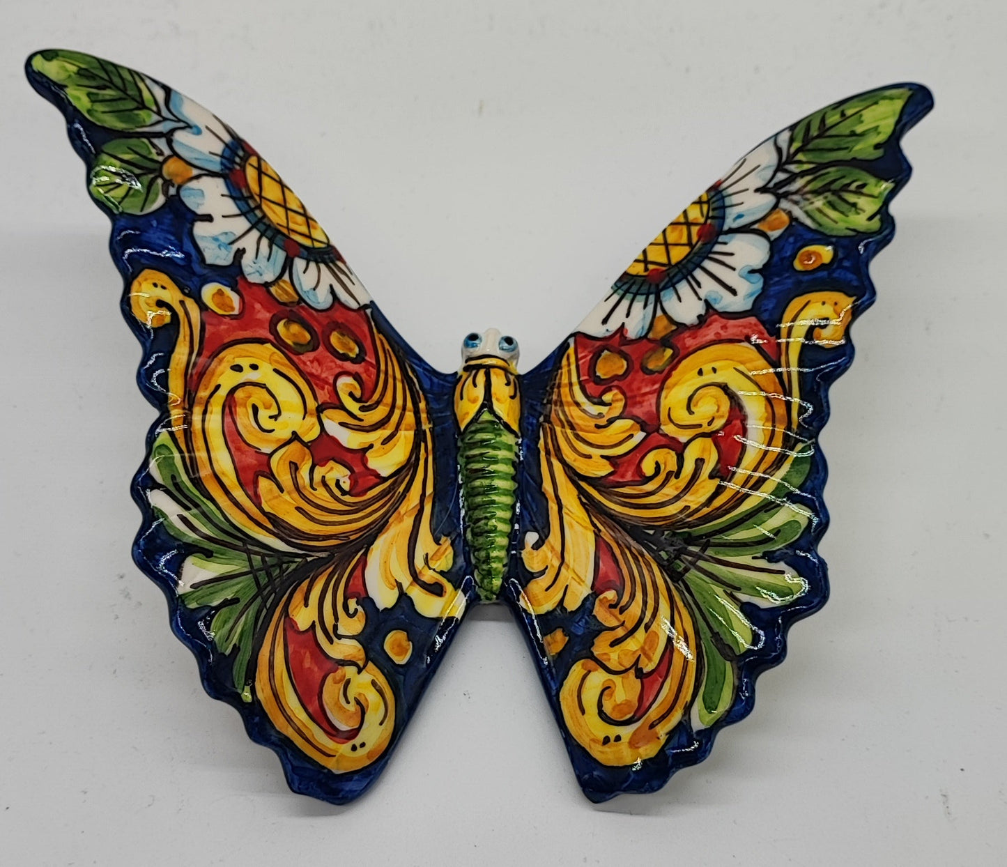 Red and green ceramic butterfly measuring 20 cm wide and 18 cm high