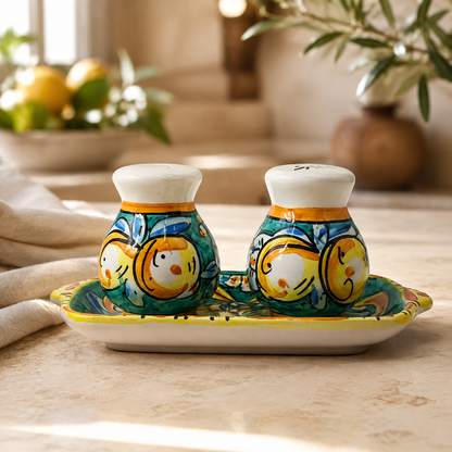 Green ceramic salt and pepper shakers measuring 7 cm high with a 20 cm tray