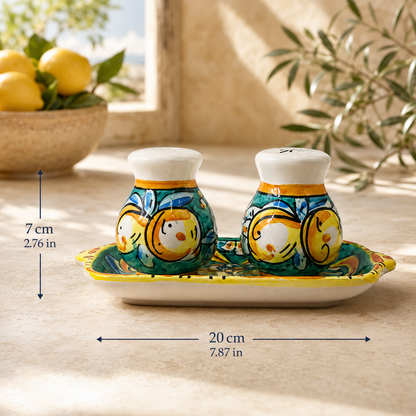 Green Sicilian ceramic salt and pepper shaker set with a matching hand-painted tray