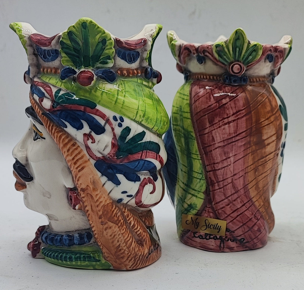 Close-up of colorful hand-painted details on traditional Sicilian Teste di Moro ceramics.