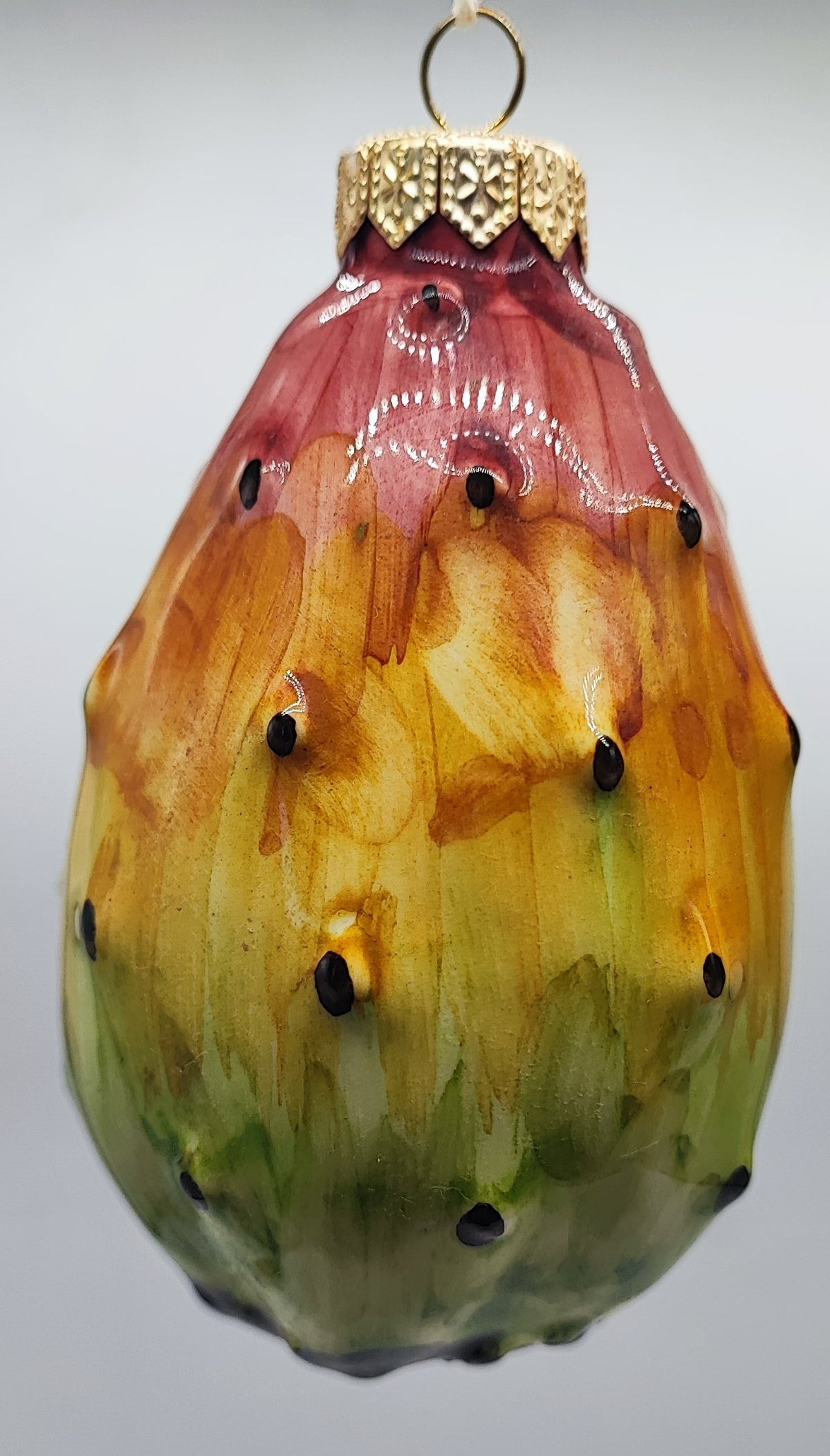 Authentic handmade Sicilian prickly pear ceramic Christmas decoration with red, orange, yellow and green hand-painted colors.