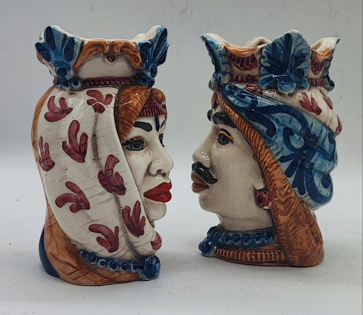 Male and female Teste di Moro pair with colorful hand-painted details inspired by Sicilian Caltagirone pottery.