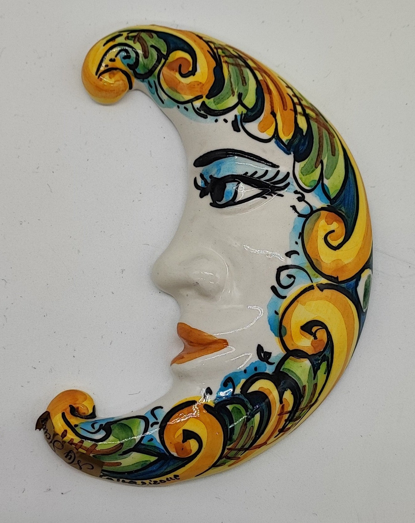 Multicolor Sicilian ceramic moon measuring 16 cm tall on an Italian terrace with lemons, oranges and flowers