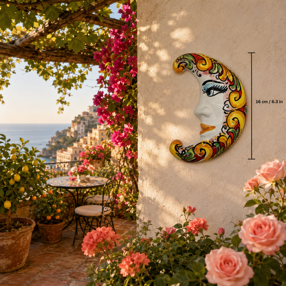 Multicolor Sicilian ceramic moon displayed on an Italian terrace with lemons, oranges and pink flowers