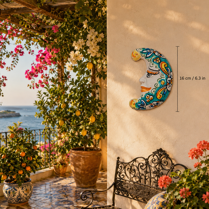 Handmade Sicilian ceramic crescent moon with yellow, orange, red and green hand-painted scroll decoration