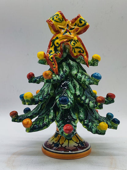 Hand-painted Italian ceramic Christmas tree presented as a unique holiday gift