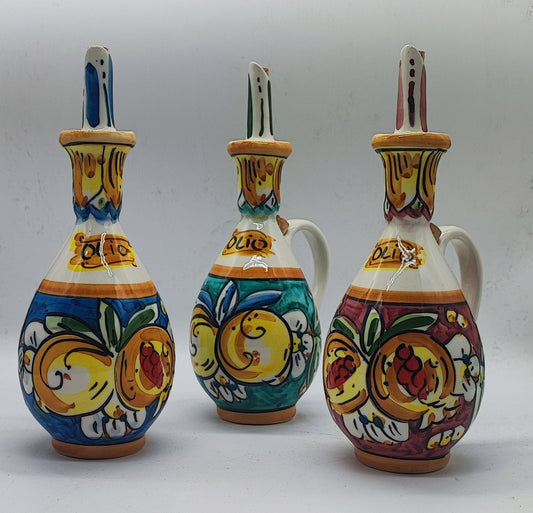 sicilian-ceramic-olive-oil-bottles-colors.jpg
Three colorful hand-painted Sicilian ceramic olive oil bottles in blue, green and red, displayed in a Mediterranean-inspired setting.