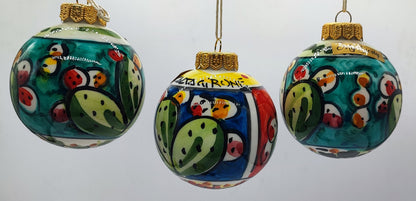 Three authentic Caltagirone ceramic Christmas ornaments with colorful cactus patterns