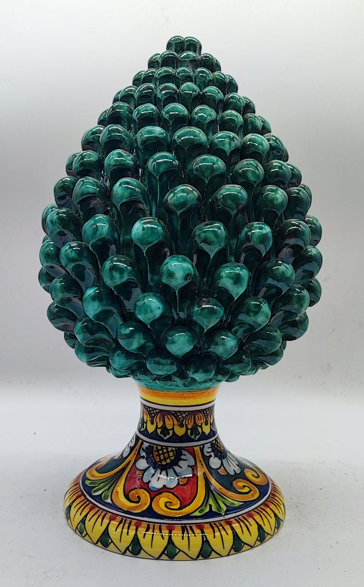 Sicilian ceramic pine cone measuring 31 cm (12.2 inches) tall and 18 cm (7.1 inches) wide, displayed on a marble mantel.