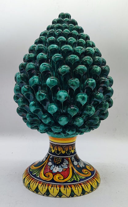 Sicilian ceramic pine cone measuring 31 cm (12.2 inches) tall and 18 cm (7.1 inches) wide, displayed on a marble mantel.