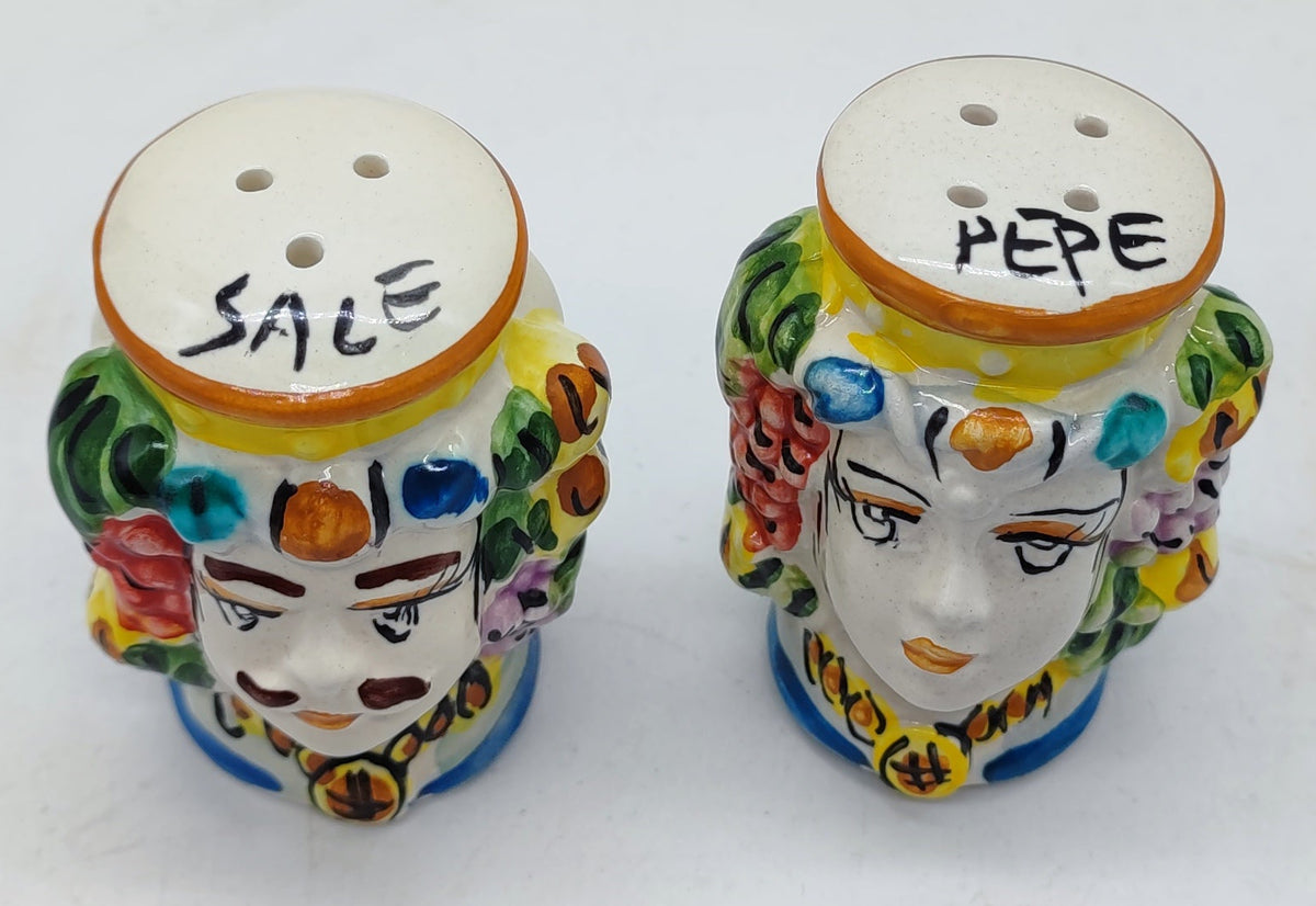 Top view of ceramic Moorish Head salt and pepper shakers showing dispensing holes and SALE and PEPE lettering.
