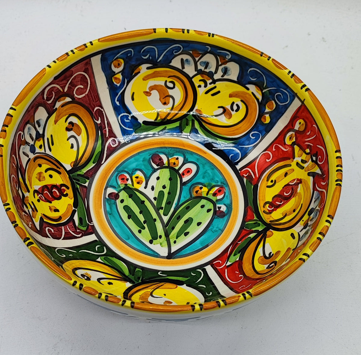 Colorful Caltagirone ceramic serving bowl featuring traditional prickly pear decoration
