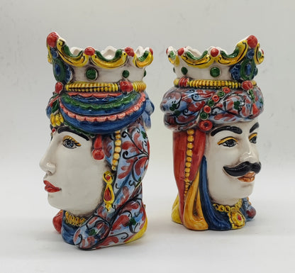 Side profiles of Donna and Maschio Sicilian ceramic Moorish Heads featuring colorful hand-painted crowns and ornamental details.