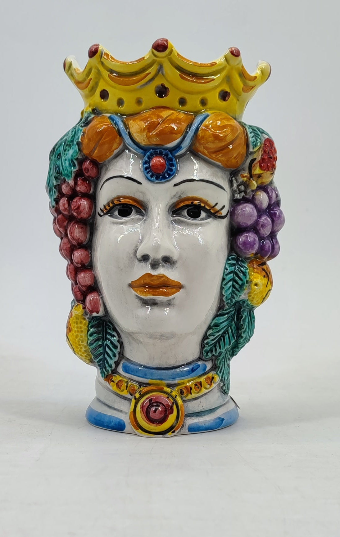 Female Sicilian Moor’s Head vase decorated with a golden crown, grapes, lemons and leaves