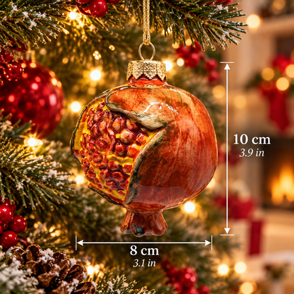 Hand-painted Sicilian ceramic pomegranate Christmas ornament with sculpted red seeds, measuring 10 cm high and 8 cm wide.
