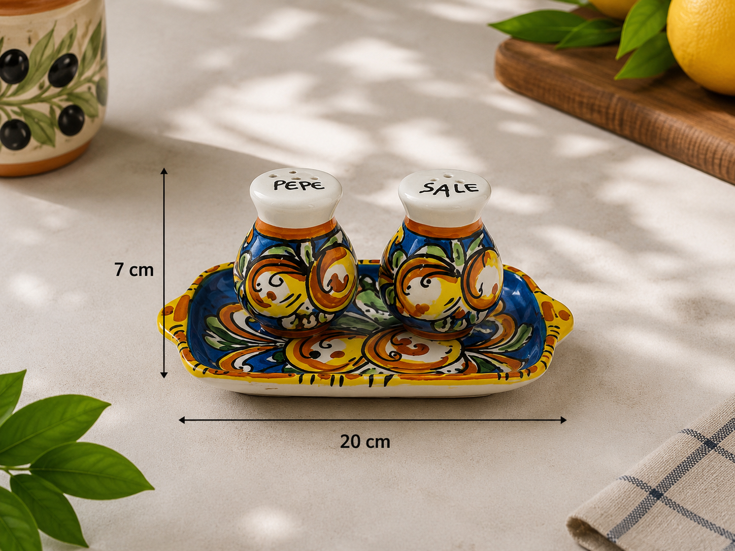 Sicilian ceramic salt and pepper shakers measuring 7 cm high with a 20 cm serving tray