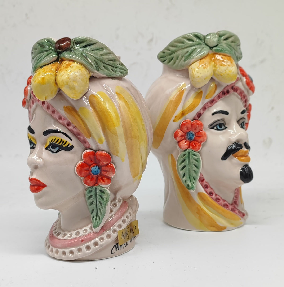 Authentic Sicilian Teste di Moro ceramic couple with lemon decorations, traditional Caltagirone pottery