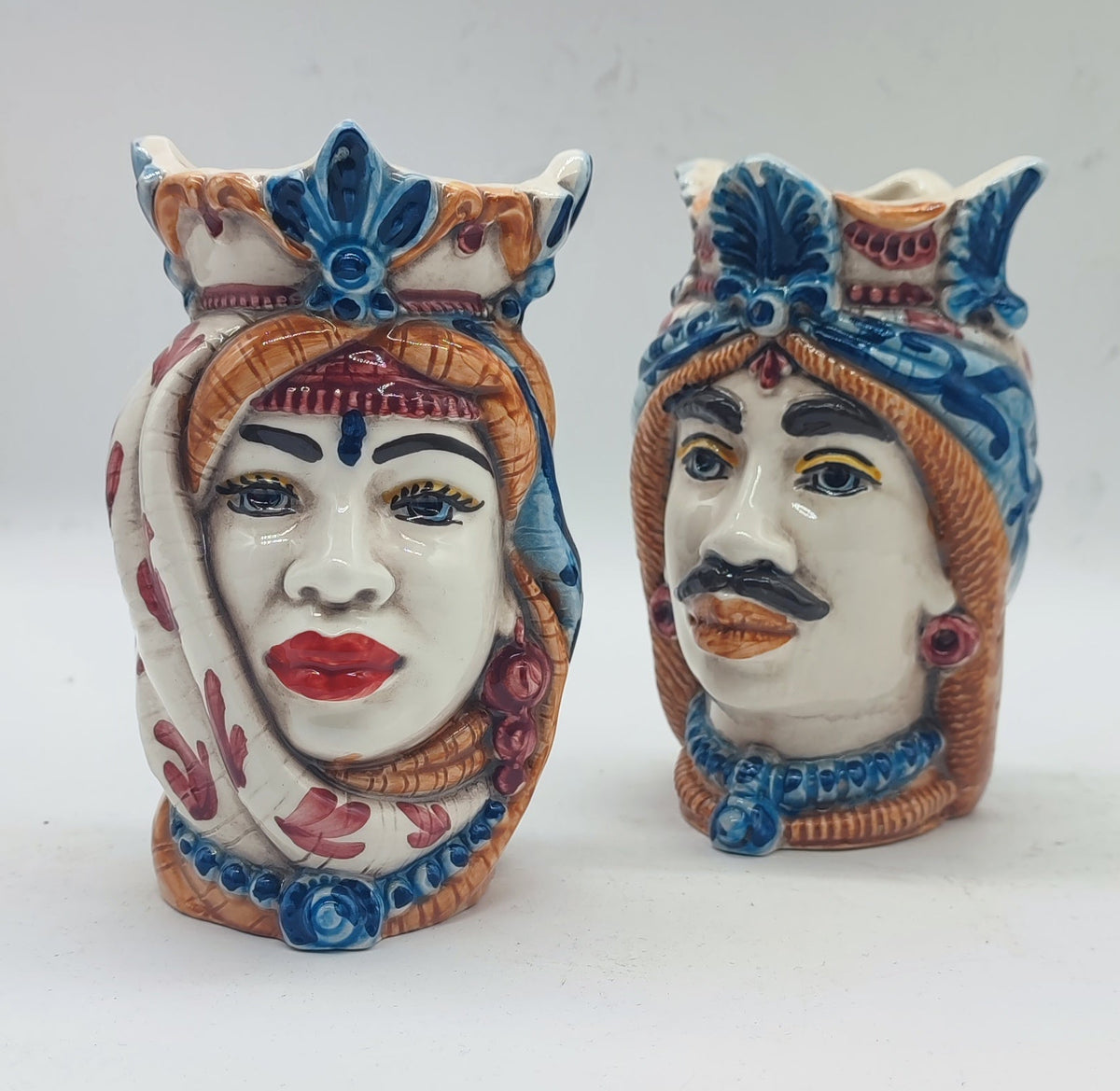 Sicilian Teste di Moro ceramic pair measuring 14 cm high and approximately 9 cm wide.