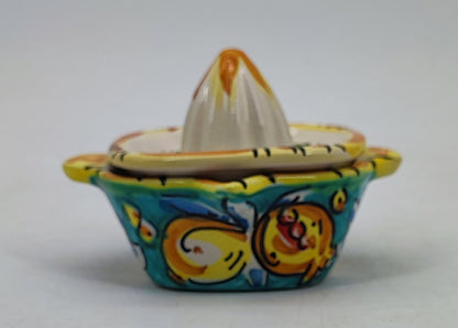 Turquoise ceramic lemon juicer measuring 11 cm high and 14 cm wide