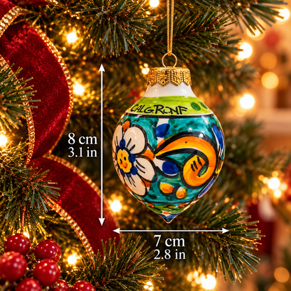 Turquoise Sicilian ceramic Christmas ornament with floral decoration, measuring 8 cm tall and 7 cm wide.