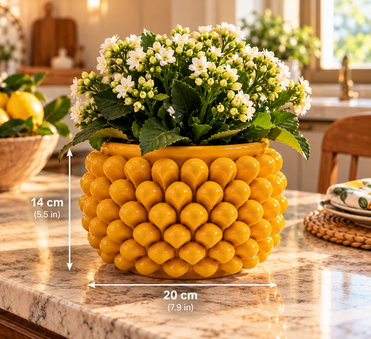 Yellow Sicilian pine cone ceramic planter with white flowers in an elegant kitchen, 20 cm wide and 14 cm high